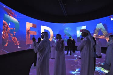 Participants watch a movie advertising Saudi’s Red Sea project on the sidelines of the Future Investment Initiatives conference in Riyadh, on October 25, 2017. (AFP)