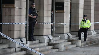 UK police shoot dead man brandishing knives near parliament