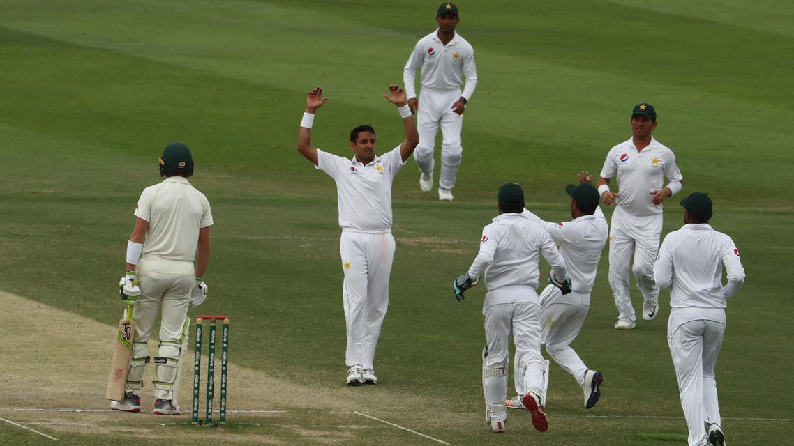 Pakistan cricketer Mohammad Abbas (2R) celebrates after dismissing Australian cricketer Marnus Labuschagne during day four of the second Test at Sheikh Zayed stadium in Abu Dhabi on October 19, 2018. (AFP)