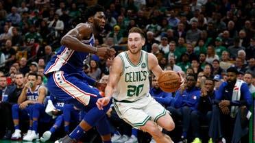 Boston Celtics guard Gordon Hayward drives past Philadelphia 76ers center Joel Embiid during the second half at TD Garden. (Greg M. Cooper/USA TODAY Sports)