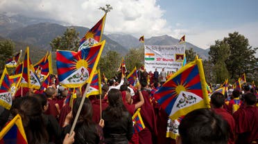 Exile Tibetans hold their national flags as they mark 58th anniversary of the March 10, 1959 Tibetan Uprising Day, in Dharmsala, India, on March 10, 2018. (AP)