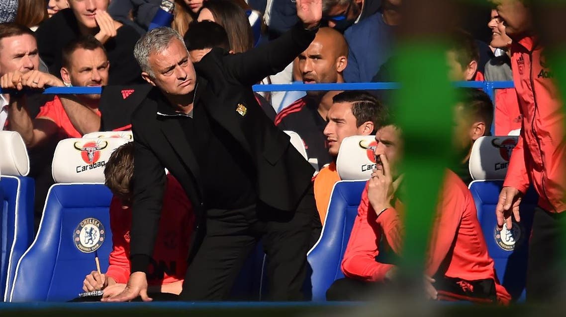 (FILES) In this file photo taken on October 20, 2018 Manchester United's Portuguese manager Jose Mourinho gestures on the touchline during the English Premier League football match between Chelsea and Manchester United at Stamford Bridge in London. Chelsea assistant coach Marco Ianni has been charged with improper conduct in a touchline flare-up with Jose Mourinho that led the Football Association to remind the Manchester United manager of his responsibilities. Glyn KIRK / AFP