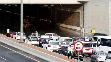 Motorists drive through a flooded tunnel in the Qatari capital Doha, following heavy rainfall. (AFP)