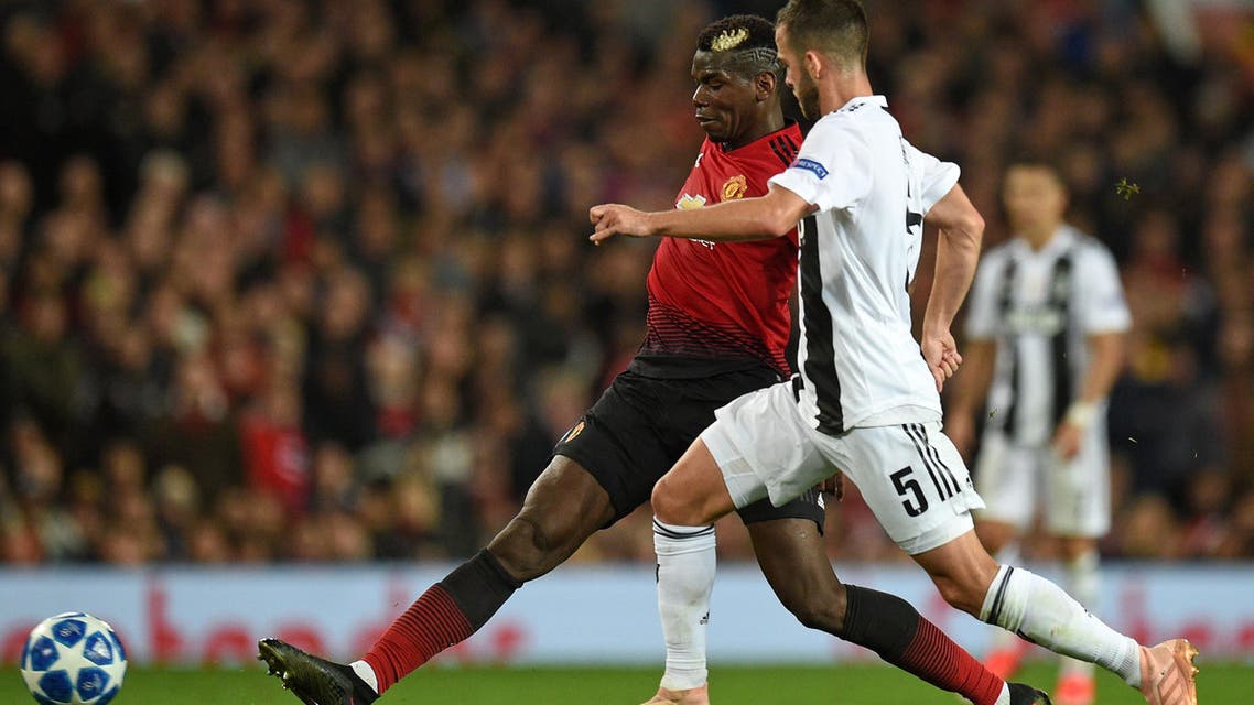Manchester United’s French midfielder Paul Pogba (L) vies with Juventus’ Bosnian midfielder Miralem Pjanic (R) during the Champions League group H football match at Old Trafford in Manchester, north west England, on October 23, 2018. (AFP)