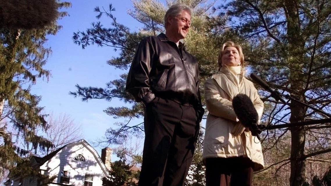 In this Jan. 6, 2000 file photo, Bill and Hillary Clinton stand in the driveway of their new home in Chappaqua, N.Y. (AP)