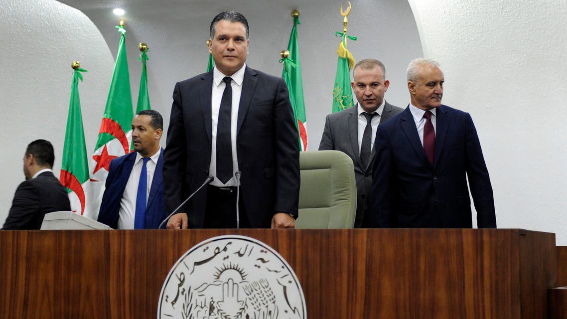 National Liberation Front's (FLN) member and newly elected president of parliament Mouad Bouchareb stands up at the president's platform of the Algerian National Assembly on October 24, 2018. The Algerian National Assembly (APN) elected on October 24, its new president, but the incumbent, Said Bouhadja, in open conflict with the parliamentary majority, proclaims itself still in office, leaving fears of a possible institutional imbroglio.