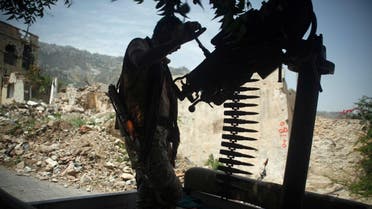A government soldier mans a machine gun mounted on a patrol truck, at a neighbourhood the army took over, after clashes with armed militants in Taiz, Yemen August 14, 2018. (Reuters)