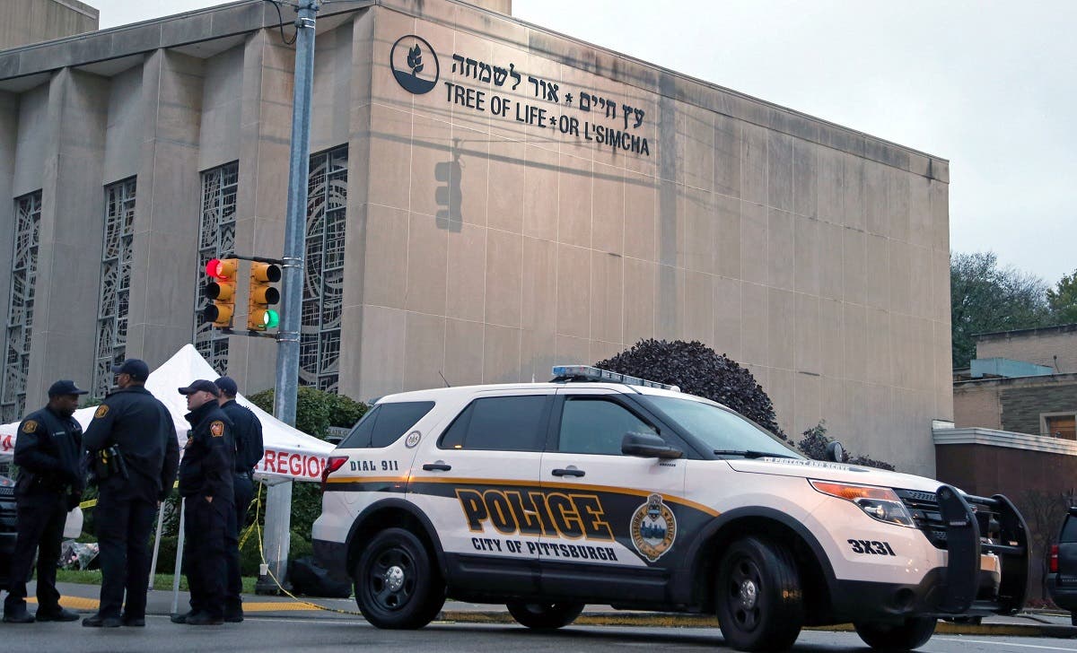 Police officers guard the Tree of Life synagogue following shooting at the synagogue in Pittsburgh, Pennsylvania. (Reuters)