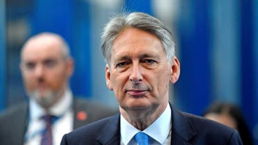 Britain's Chancellor of the Exchequer Philip Hammond arrives at the ICC for the third day of the Conservative Party Conference in Birmingham. (Reuters)