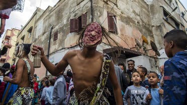Young Moroccans take part in the Boujloud festival, a popular festival also known as the 'Moroccan Halloween' in the Sidi Moussa district of Sale near Rabat. (AFP)