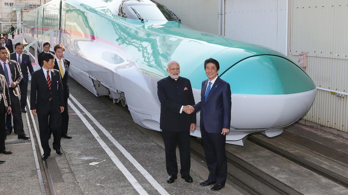 Prime Minister Narendra Modi (7L) and Japanese Prime Minister Shinzo Abe (6L) during ground breaking ceremony for the high speed rail project in Ahmedabad on September 14, 2017. (AFP)