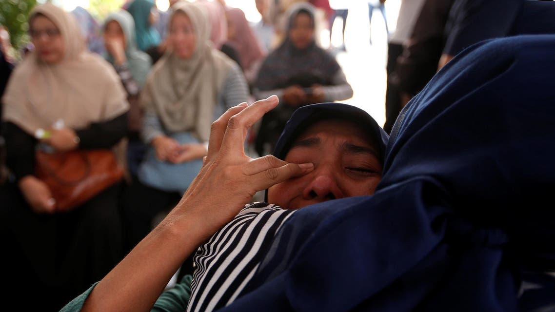 A woman, who is family of passengers on the crashed Lion Air flight JT610, cries at Bhayangkara R. Said Sukanto hospital in Jakarta. (Reuters)