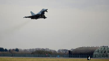 An RAF Typhoon jet takes off during a visit by Britain's Prince William, Duke of Cambridge to RAF Coningsby in Lincolnshire on March 7, 2018. 