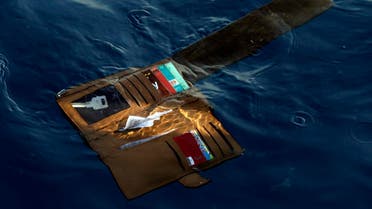 A wallet belonging to a victim of the Lion Air passenger jet that crashed floats in the waters of Ujung Karawang, West Java, Indonesia. (AP)
