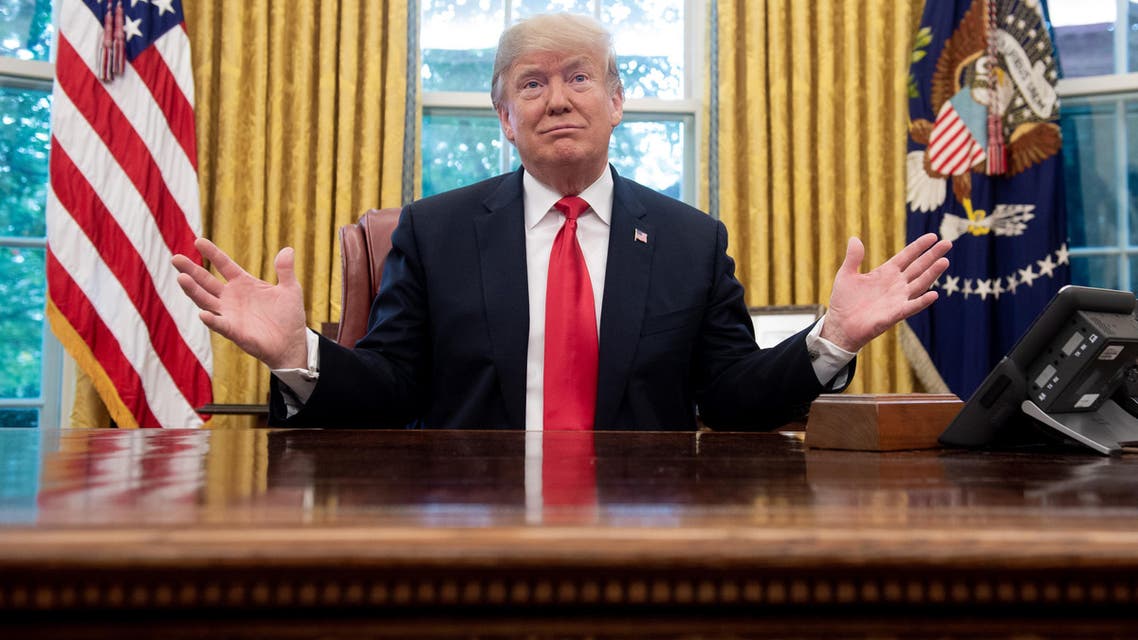 (FILES) In this file photo taken on October 10, 2018 US President Donald Trump speaks during a briefing on Hurricane Michael in the Oval Office of the White House in Washington, DC. President Donald Trump kept up the pressure on Mexico October 31, 2018 to halt groups of migrants heading to the American border, as the US enters the final stretch of campaigning before key midterm elections. Trump has sought to put immigration front and center ahead of next week's hotly-contested vote, ordering thousands of troops to the southern border and threatening to end automatic citizenship for US-born children of immigrants.