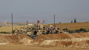 A picture taken on May 8, 2018 shows vehicles of the US-backed coalition forces in the northern Syrian town of Manbij. The Syrian Observatory for Human Rights, a Britain-based monitor with sources on the ground, says around 350 members of the US-led coalition -- mostly American troops -- are stationed around Manbij.