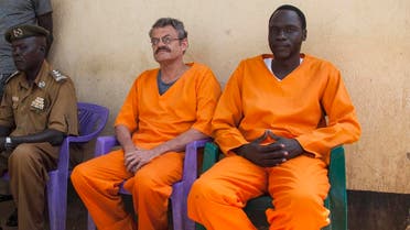 Endley (C) and Gatdet sit inside the prison before their release on November 2, 2018 in Juba. (AFP)
