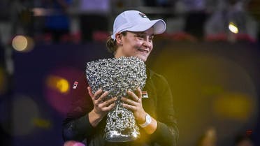 Ashleigh Barty of Australia holds the trophy after winning the women's singles final match against Wang Qiang of China at the Zhuhai Elite Trophy tennis tournament in Zhuhai. (AFP)