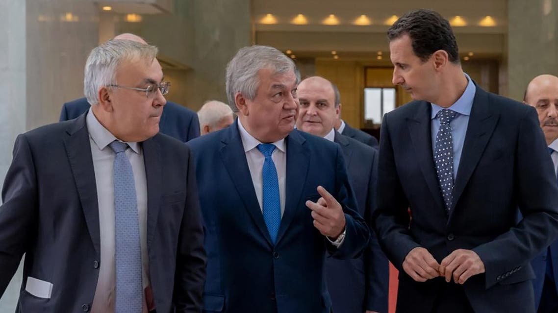 Syrian President Basah al-Assad (R) receiving Russian special envoy to Syria Alexander Lavrentiev (C) (AFP)