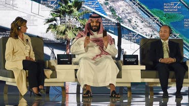 Saudi Crown Prince Mohammed bin Salman (C) and Masayoshi Son, CEO of SoftBank, attend the Future Investment Initiative conference in Riyadh, on October 24, 2017. (AFP)