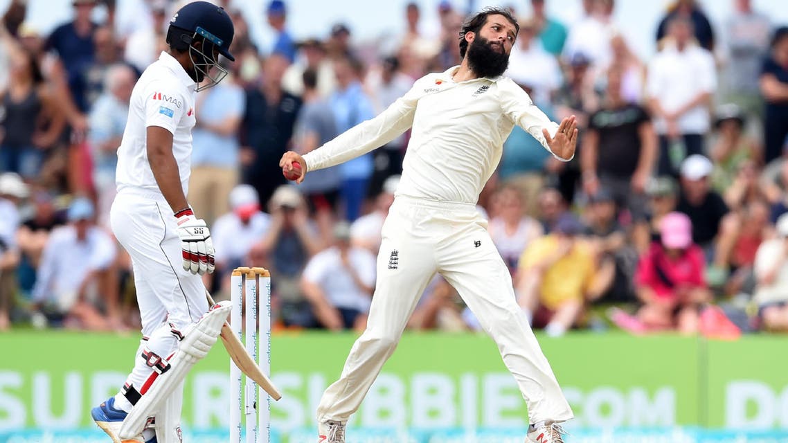 England’s Moeen Ali (R) bowls during the fourth day of the opening Test match between Sri Lanka and England at the Galle International Cricket Stadium in Galle on November 9, 2018. (AFP)