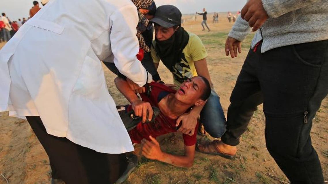 A wounded protester is evacuated during clashes near the border between Israel and Khan Yunis in the southern Gaza Strip on November 9, 2018. (AFP)