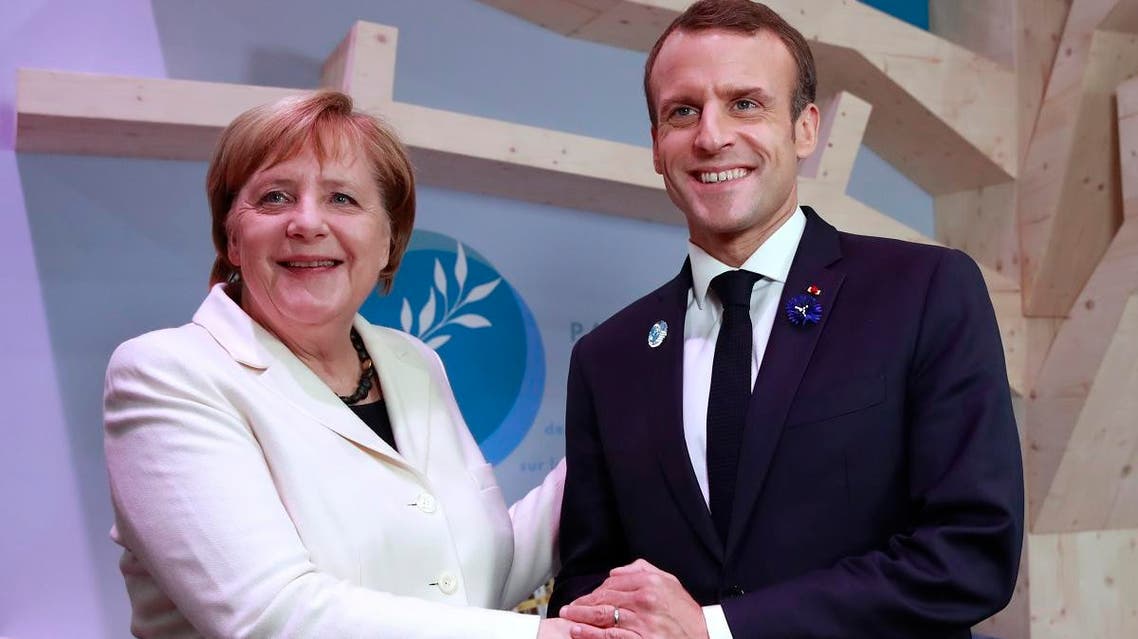 German Chancellor Angela Merkel and French President Emmanuel Macron in Paris (AP)