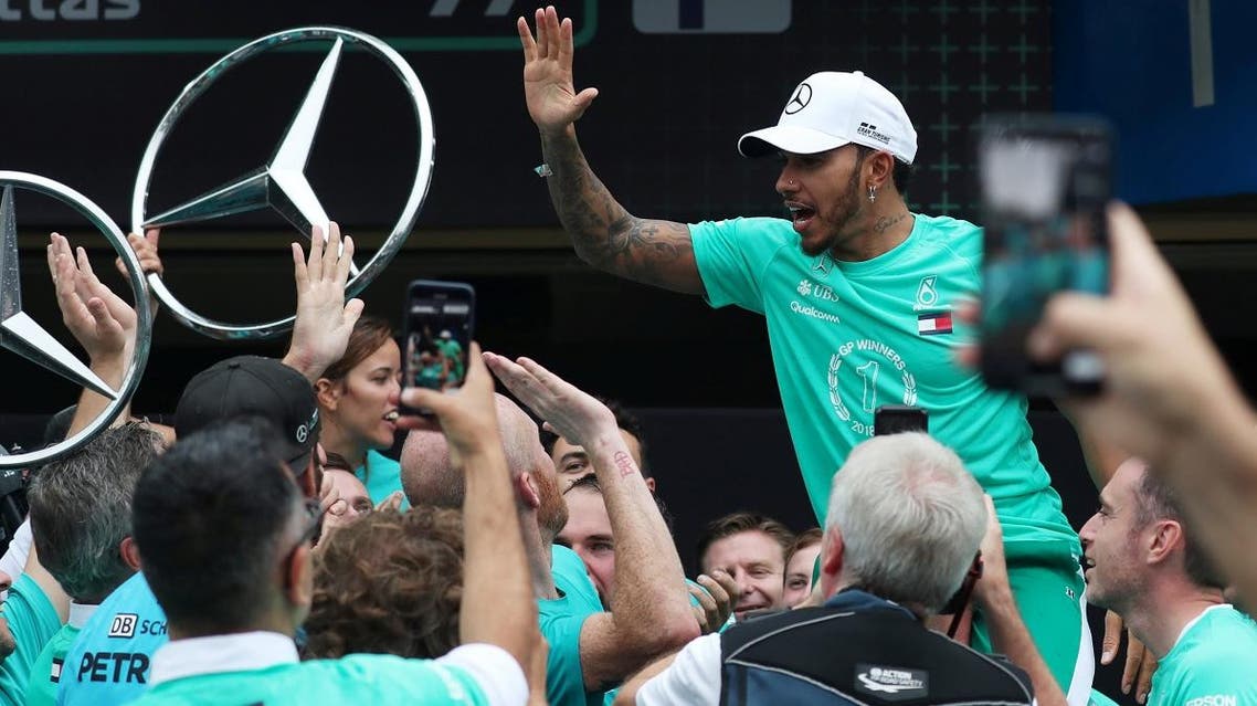 Mercedes’ Lewis Hamilton and team members celebrate after winning the constructors championship in Sao Paulo, Brazil, on November 11, 2018. (Reuters)