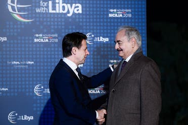 Italian Prime Minister Giuseppe Conte (L) greets Libya Chief of Staff, Marshall Khalifa Haftar upon his arrival for a conference on Libya on November 12, 2018. (AFP)