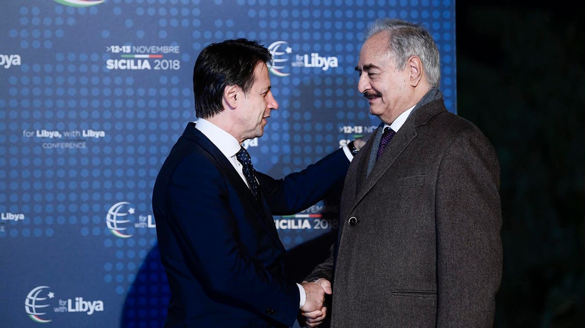Italian Prime Minister Giuseppe Conte (L) greets Libya Chief of Staff, Marshall Khalifa Haftar upon his arrival for a conference on Libya on November 12, 2018. (AFP)