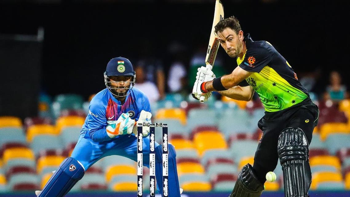 Australia’s batsman Glenn Maxwell (R) hits a shot off the bowling of India’s Krunal Pandya during the T20 international cricket match between Australia and India in Brisbane on November 21, 2018.