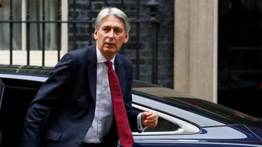 Britain's Chancellor of the Exchequer, Philip Hammond, arrives back at 11 Downing Street, in London. (Reuters)