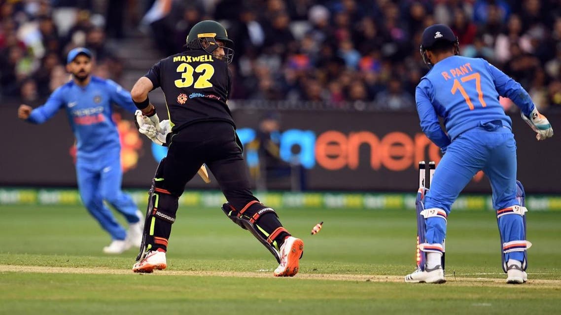 Australia’s batsman Glenn Maxwell (C) looks back to see he is bowled as India’s wicketkeeper Rishabh Pant (R) and captain Virat Kohli look on at the MCG in Melbourne on November 23, 2018. (AFP)