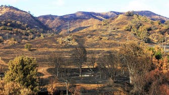 Rain hinders search but helps nearly put out California fire