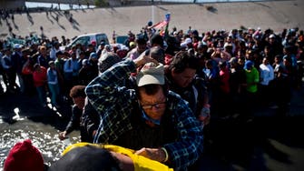 After hundreds of Mexicans tried to breach fence, US re-opens border crossing