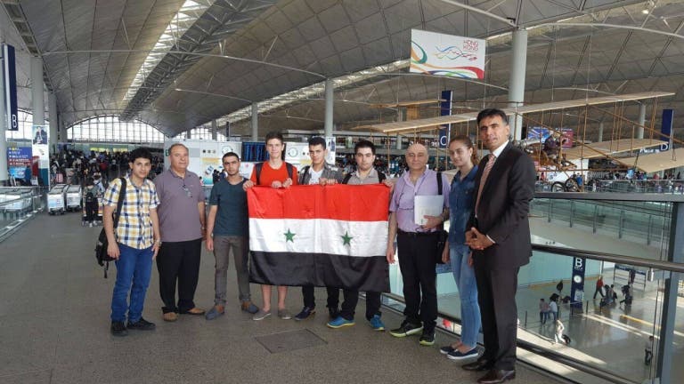 العزب مرافقا ابن بشار الأسد إلى هونغ كونغ