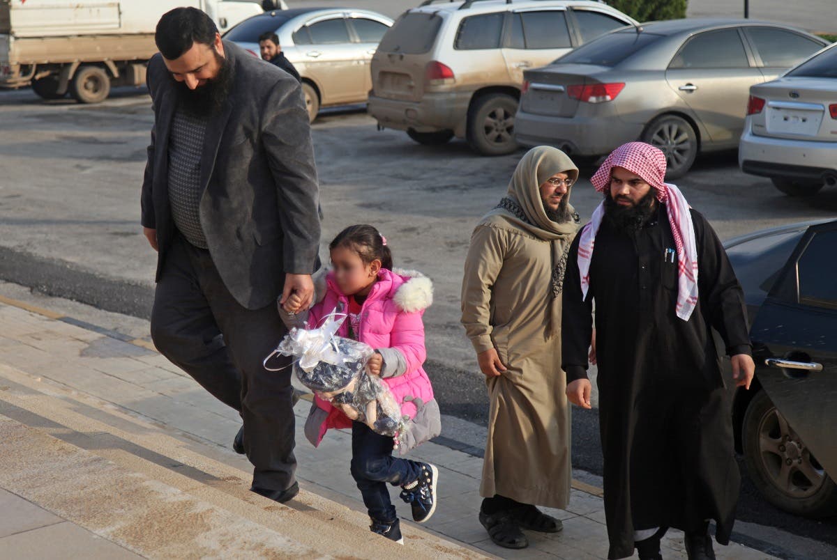 Syria's Hayat Tahrir al Sham return 4-year-old girl to her belgian mother. (AFP)