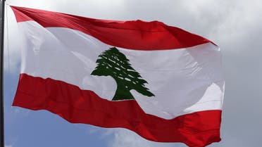 A picture taken on May 6, 2016 shows a giant Lebanese flag fluttering in Martyrs square in central Beirut at the occasion of the 100 years since the hanging in public of several Lebanese nationalists who opposed the Ottoman rule during World War I on May 6, 1916. 