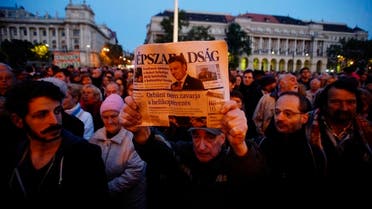 A man shows the last printed edition of Nepszabadsag during a demonstration organised to express solidarity with Hungarian political daily Nepszabadsag in Budapest, Hungary. (File photo: AP)