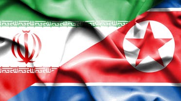 Waving flag of North Korea Iran - Stock image
