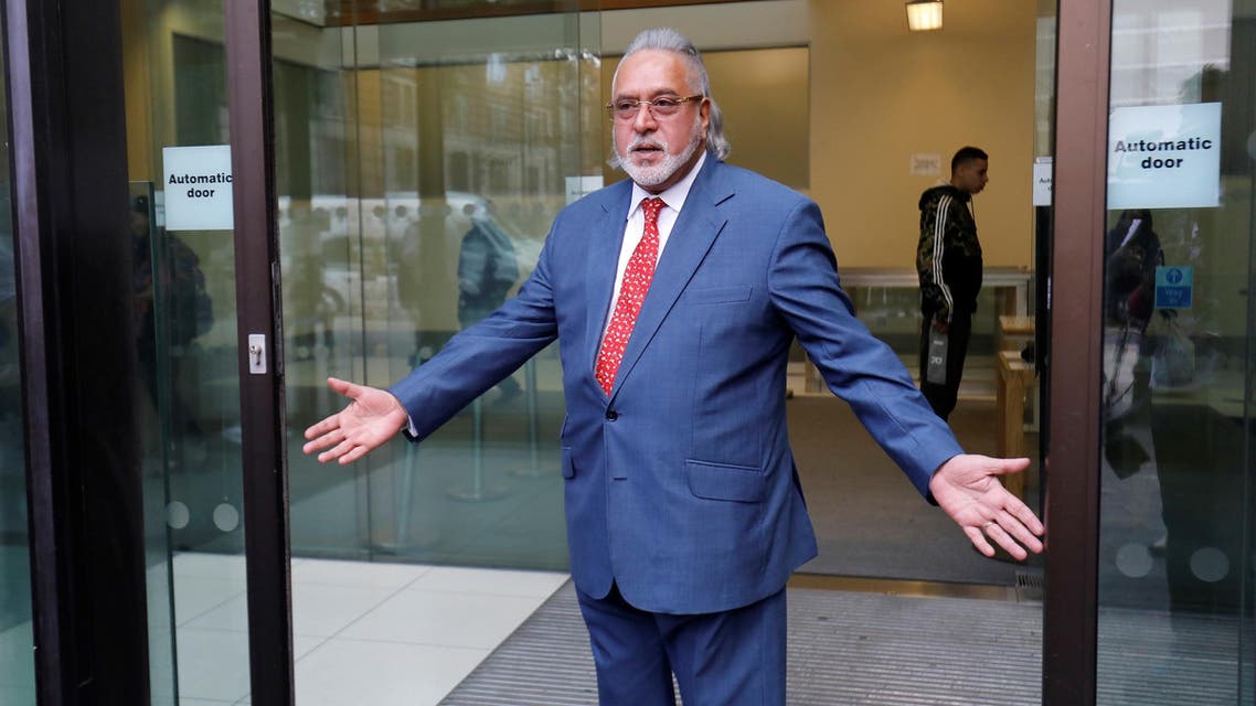 Vijay Mallya gestures to members of the media as he leaves after appearing at Westminster Magistrates Court in central London on July 31, 2018. (AFP)
