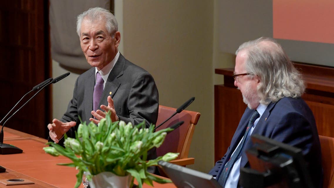 The 2018 Nobel Prize laureates in Physiology or Medicine Japanese scientist Tasuku Honjo (L) and James Allison attend a press conference at Karolinska Institutet in Stockholm, Sweden, on December 6, 2018.