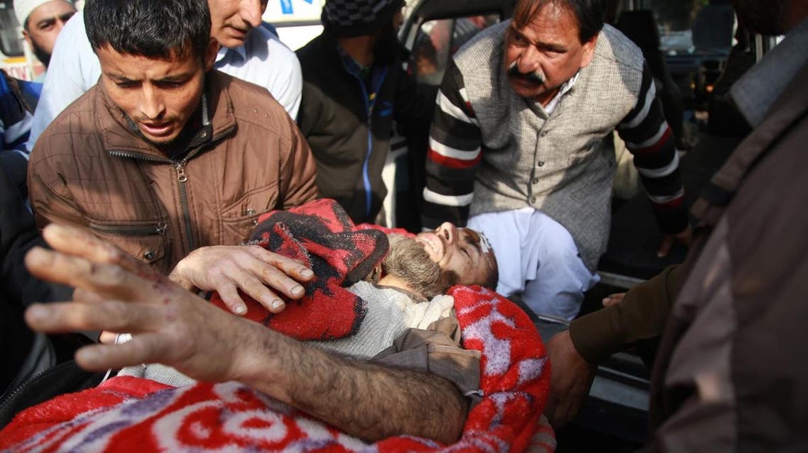 An injured passenger is brought to a hospital for treatment in Jammu on December 8, 2018. (AFP)