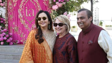 Former US Secretary of State Hillary Clinton poses with Mukesh Ambani, Chairman of Reliance Industries, and his wife Nita Ambani after her arrival in Udaipur in India to attend pre-wedding celebrations of their daughter Isha Ambani on December 8, 2018. (Reuters)
