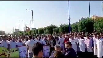 WATCH: Iran workers dress in burial clothes protest, chant against the regime