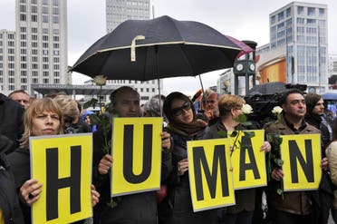 Protesters hold up letters, spelling “Human Rights,” during a rally to demand the release of political prisoners in Iran as part of a “Global day of action” in Berlin on July 25, 2009. (AFP)