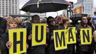 Protesters hold up letters, spelling “Human Rights,” during a rally to demand the release of political prisoners in Iran as part of a “Global day of action." (File photo: AFP)