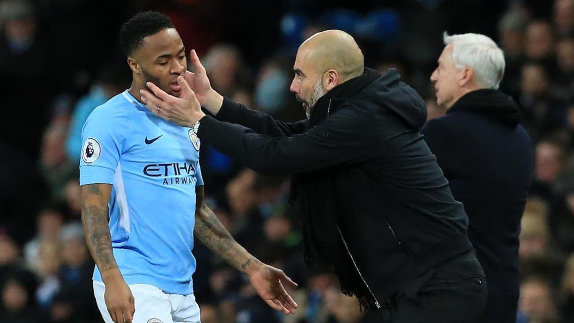 Manchester City's Spanish manager Pep Guardiola gestures to Manchester City's English midfielder Raheem Sterling. (AFP)