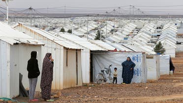 Syrian refugee women stand in front of their homes at Azraq refugee camp, near Al Azraq city, Jordan, December 8, 2018. REUTERS/Muhammad Ham