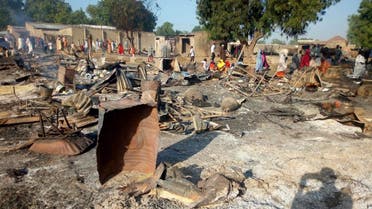 People gather at the site of an attack in Maiduguri, Nigeria, Thursday, Nov. 1, 2018, after dozens of attackers overpowered soldiers guarding the camp and fighting continued for about two hours. (AP)